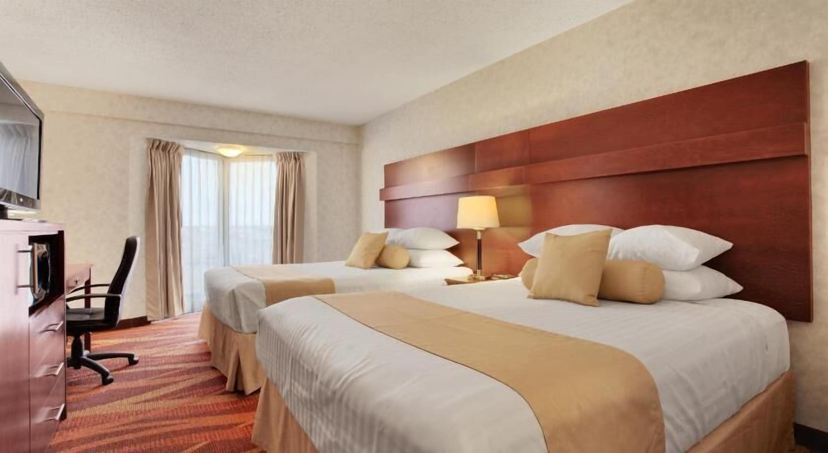 Pillow-top beds, desk, blackout curtains, iron/ironing board