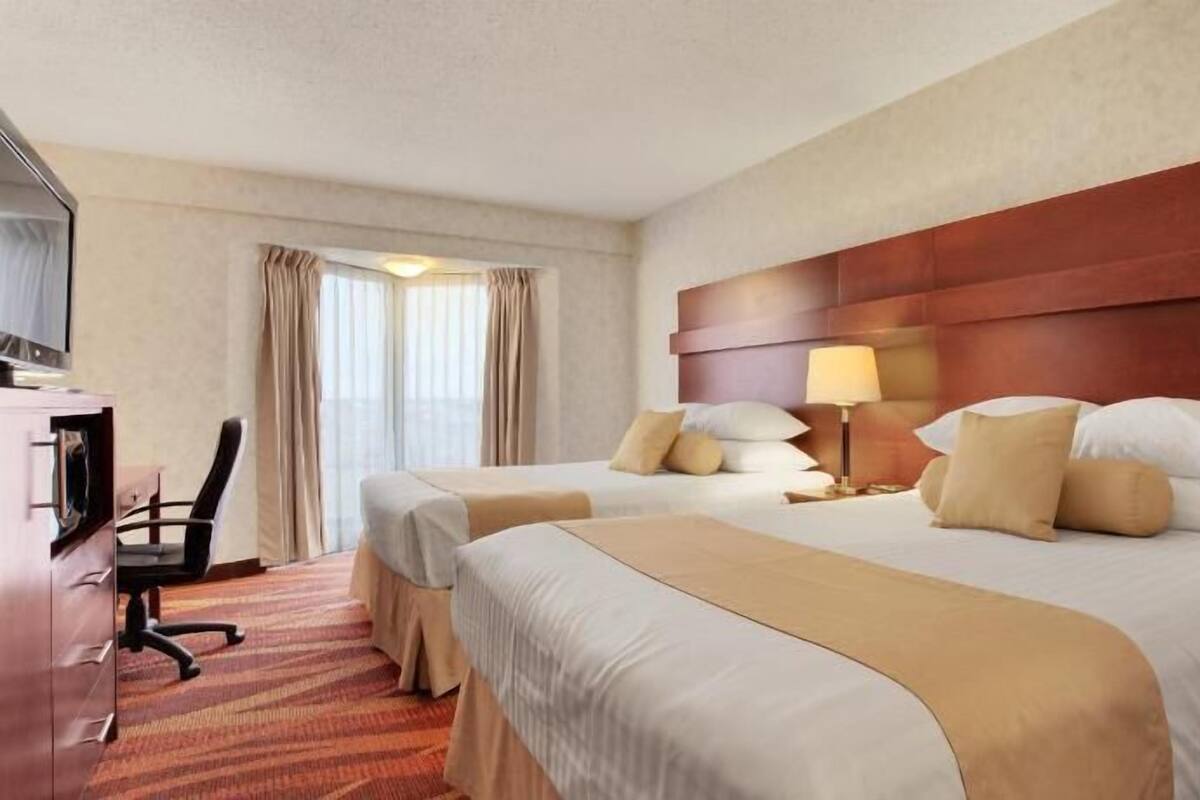 Pillow-top beds, desk, blackout curtains, iron/ironing board