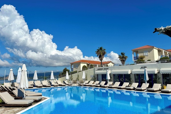 Seasonal outdoor pool, open 7 AM to 8:30 PM, pool umbrellas