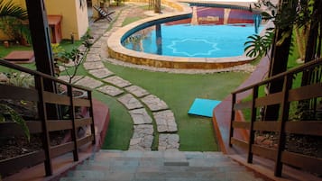 Indoor pool, open 8:00 AM to 8:00 PM, pool umbrellas, pool loungers