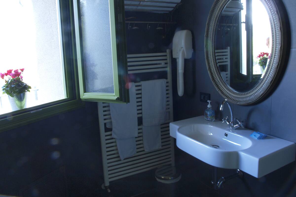Shower, rainfall showerhead, designer toiletries, hair dryer