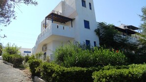 A modern two-story building with a flat roof and a balcony. - Thalia Apartments (Malevizi)