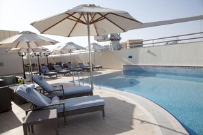 Outdoor pool, pool umbrellas, sun loungers