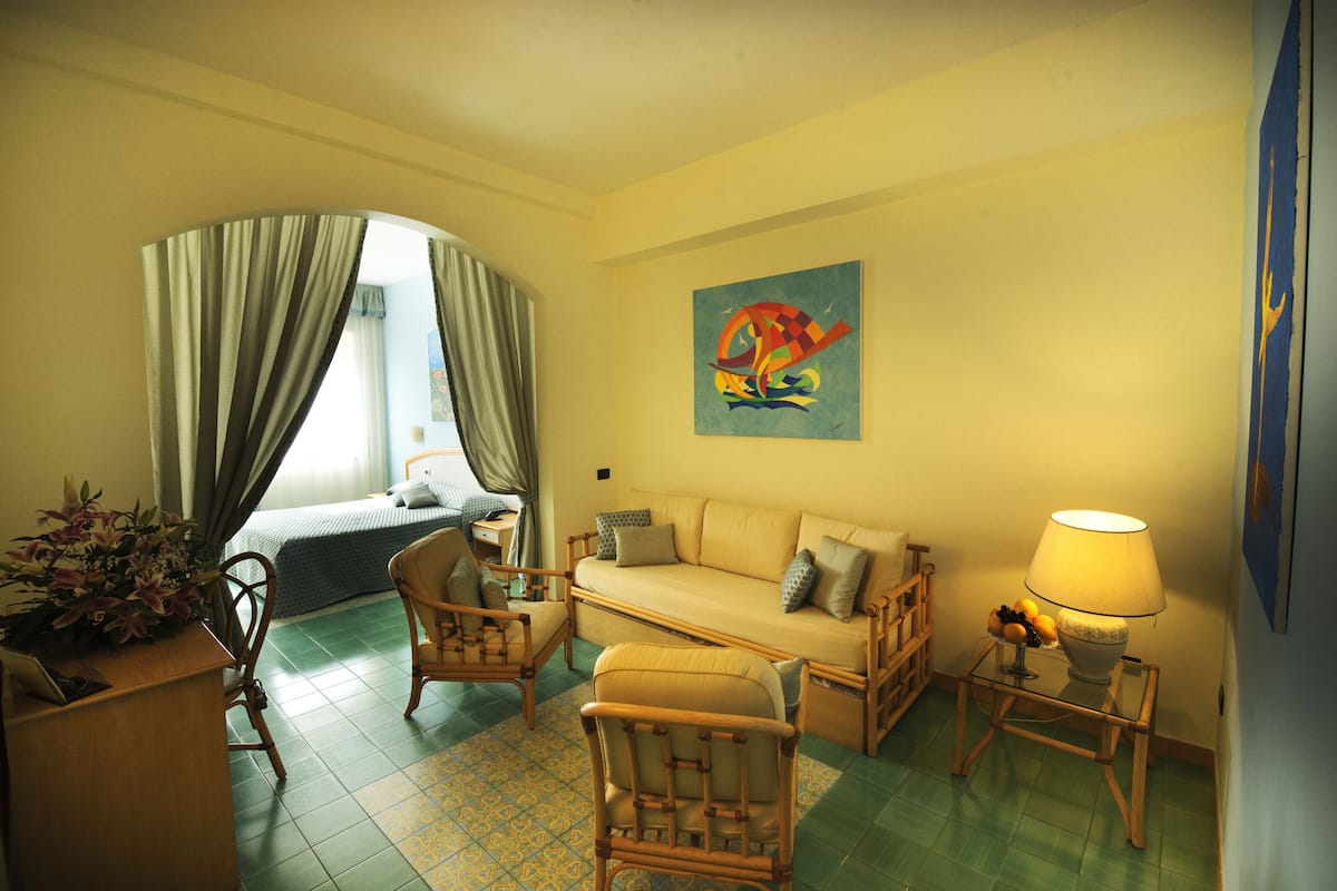 Family Quadruple Room, Garden View | Minibar, in-room safe, desk, free WiFi