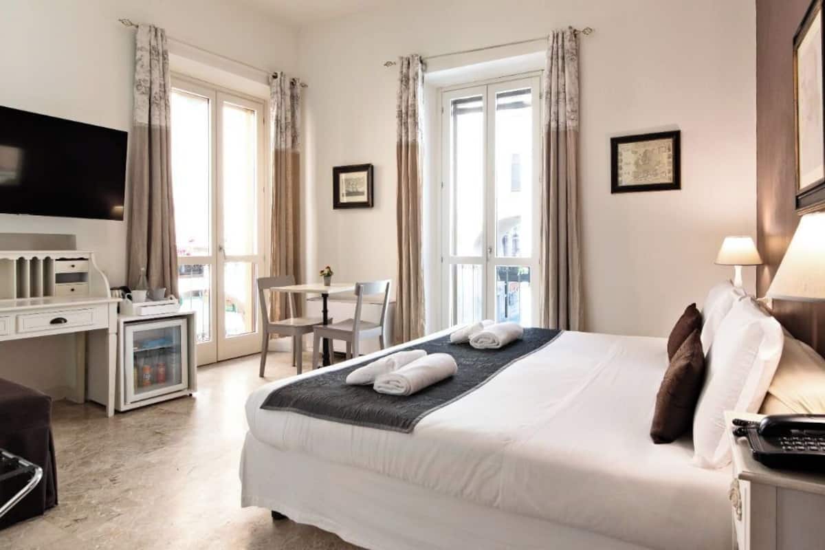 Junior Suite, City View | Down comforters, in-room safe, desk, blackout drapes