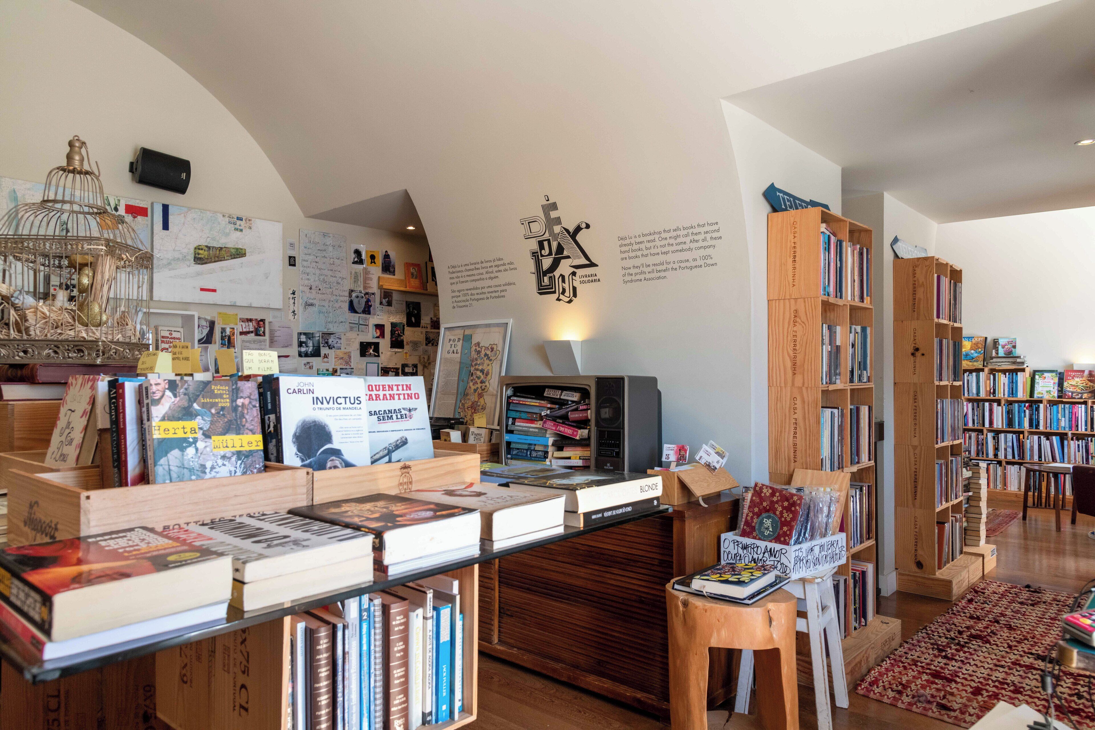 A cozy bookstore with wooden shelves and a variety of books.