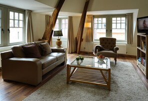 Apartment, 1 Bedroom | Living area | Flat-screen TV, DVD player