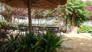 Breakfast, lunch, dinner served; local cuisine, garden views