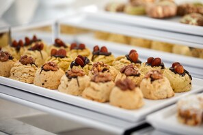 A display of assorted pastries on a white tray. - Albinas Hotel Old City (Istanbul)