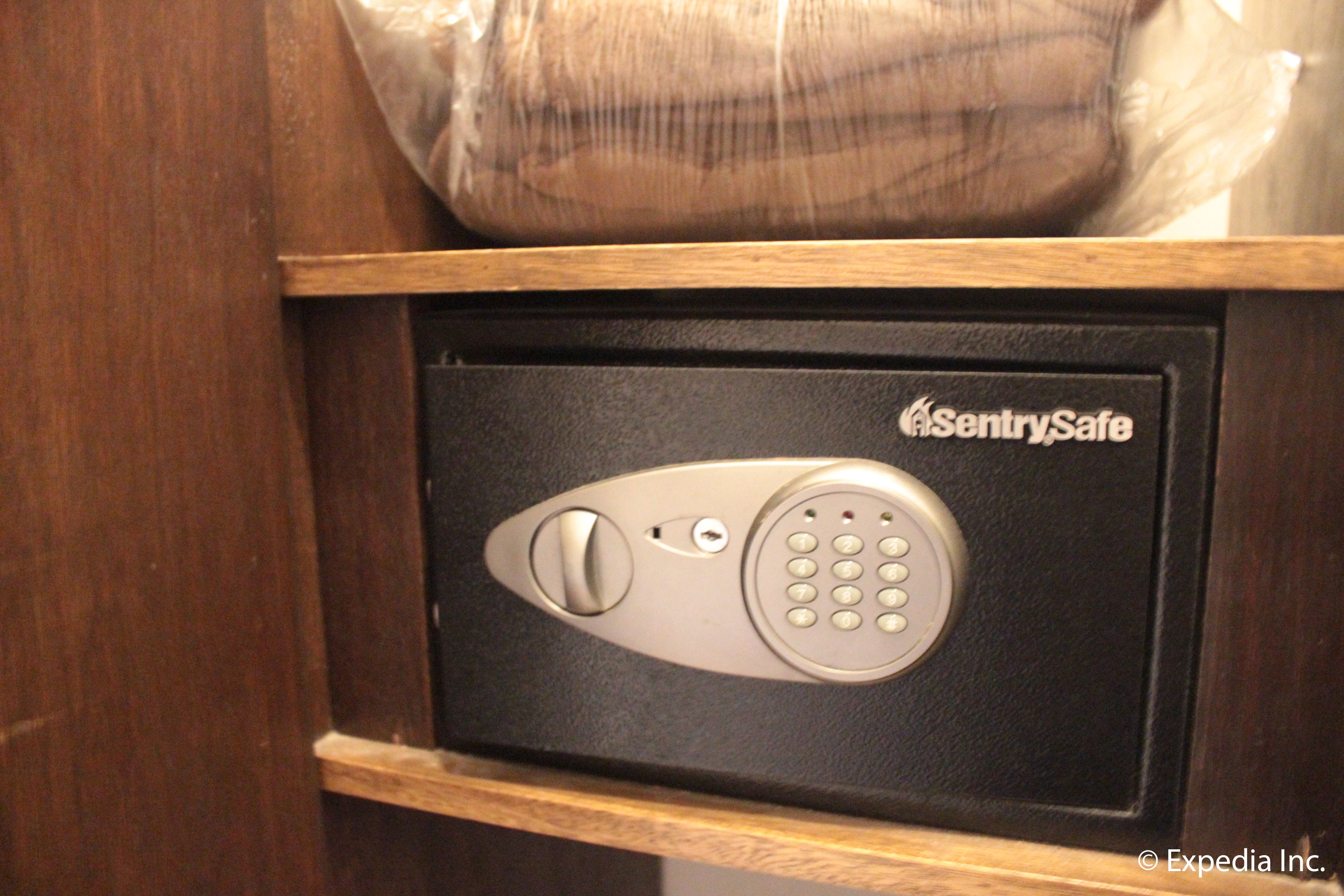 A black safe with a keypad and a keyhole, labeled 'SentrySafe'.