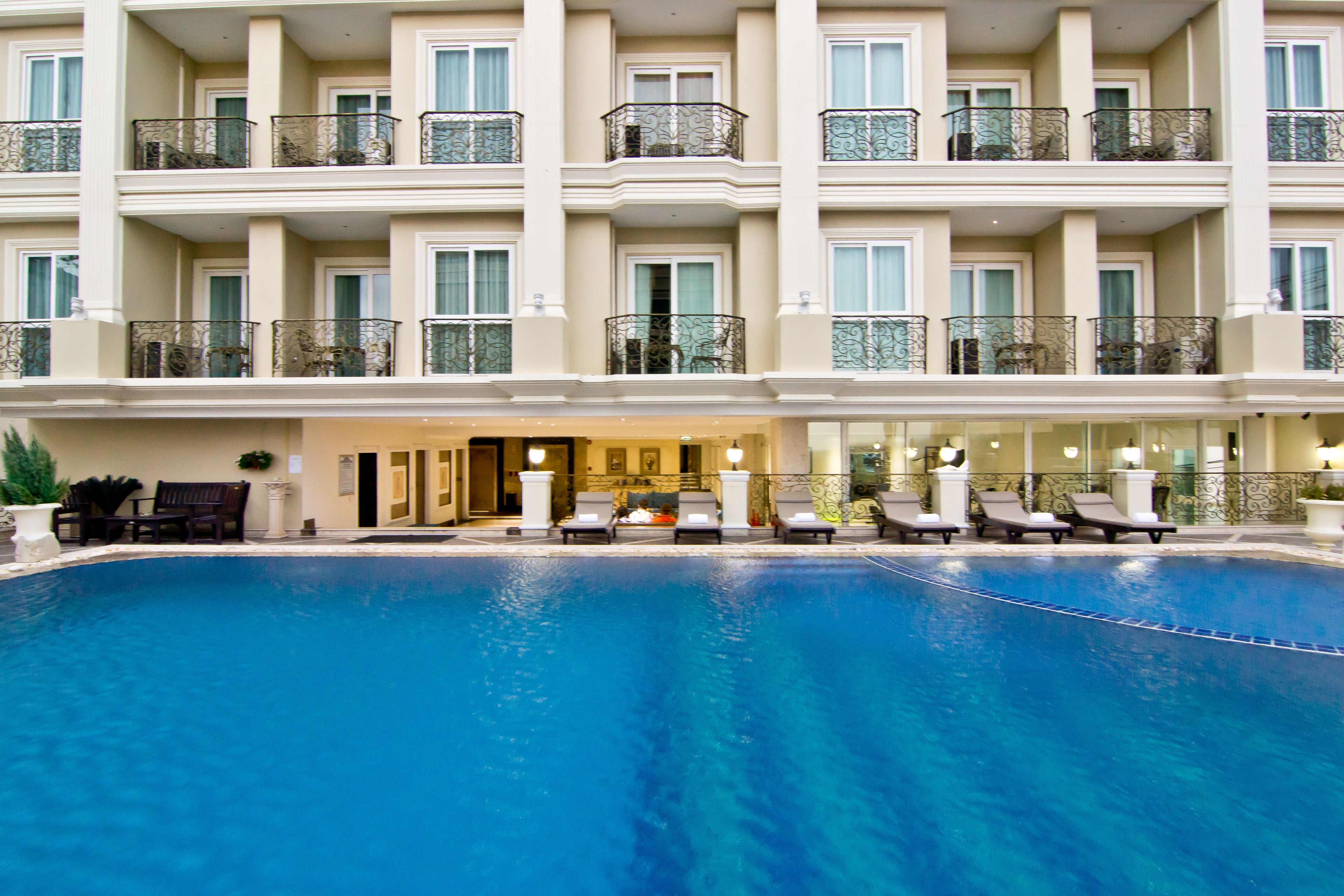 outdoor pool, open 7 am to 7 pm, pool umbrellas, pool loungers