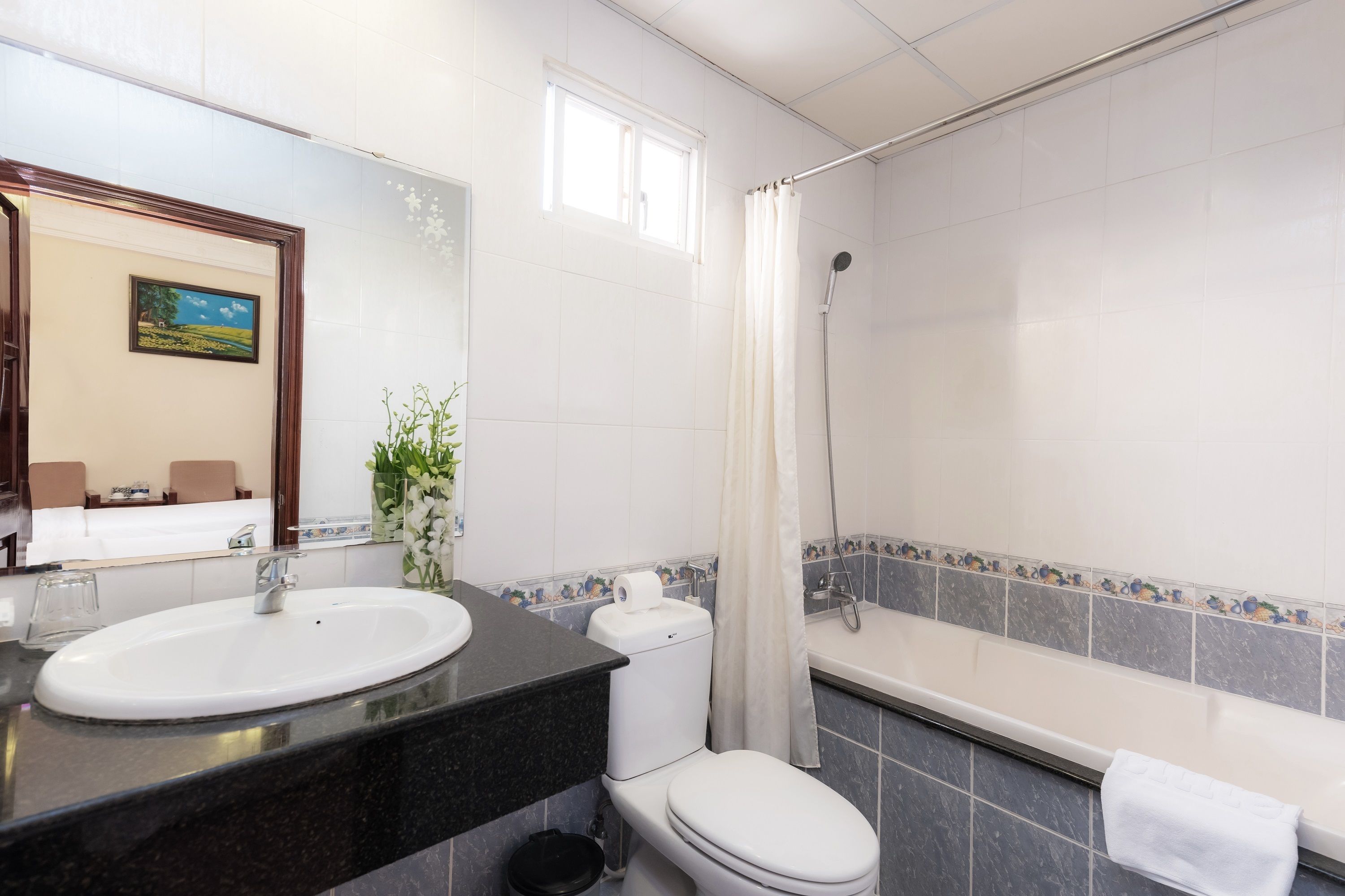 superior triple room (no window) | bathroom | free toiletries, hair dryer, bathrobes, slippers