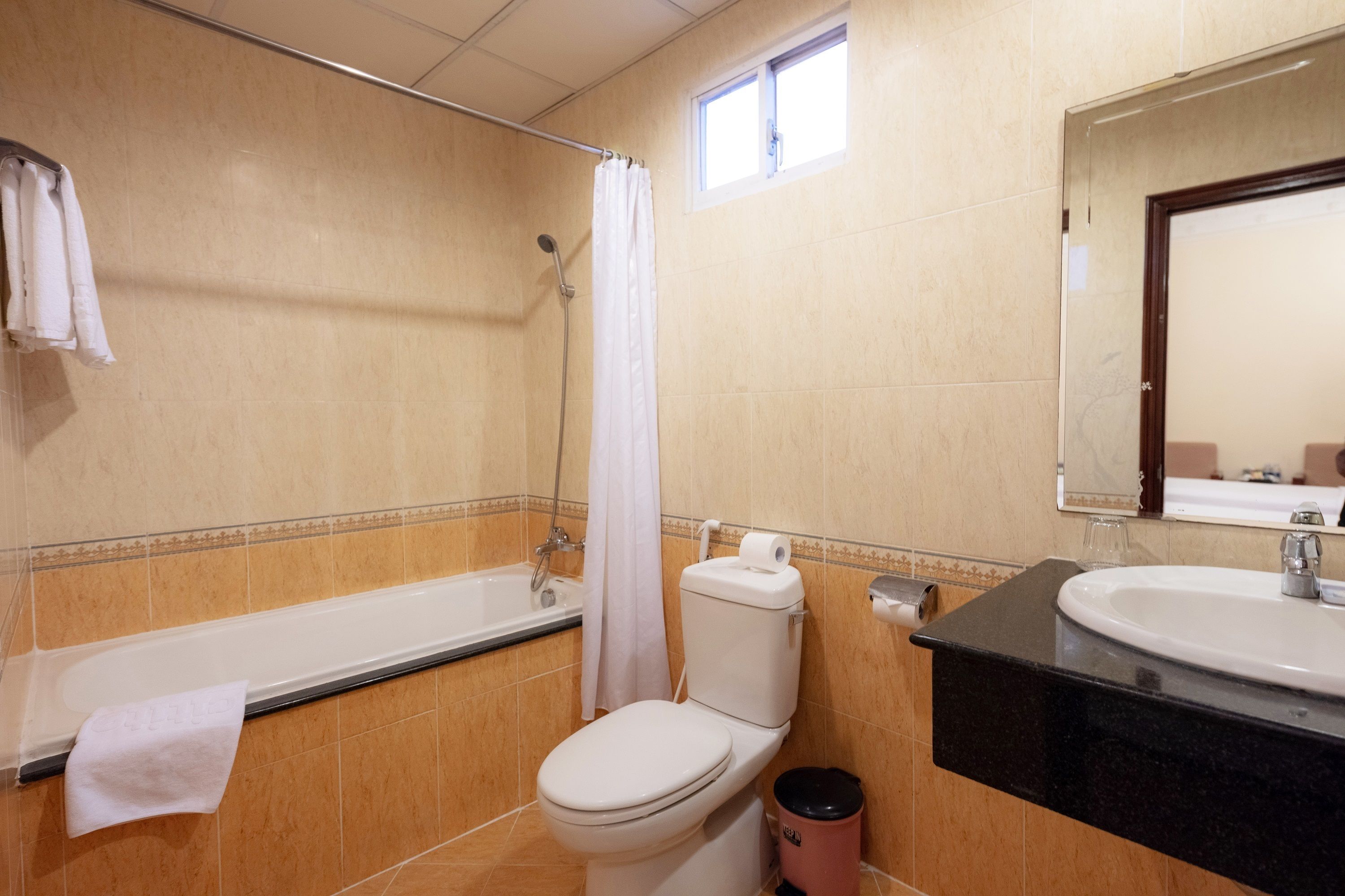 economy double room (no window) | bathroom | free toiletries, hair dryer, bathrobes, slippers