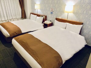 A hotel room with two beds, a nightstand with a phone, and a sign indicating Wi-Fi availability. - Tokyo Plaza Hotel (Tokyo)