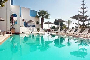 Outdoor pool, pool umbrellas, pool loungers