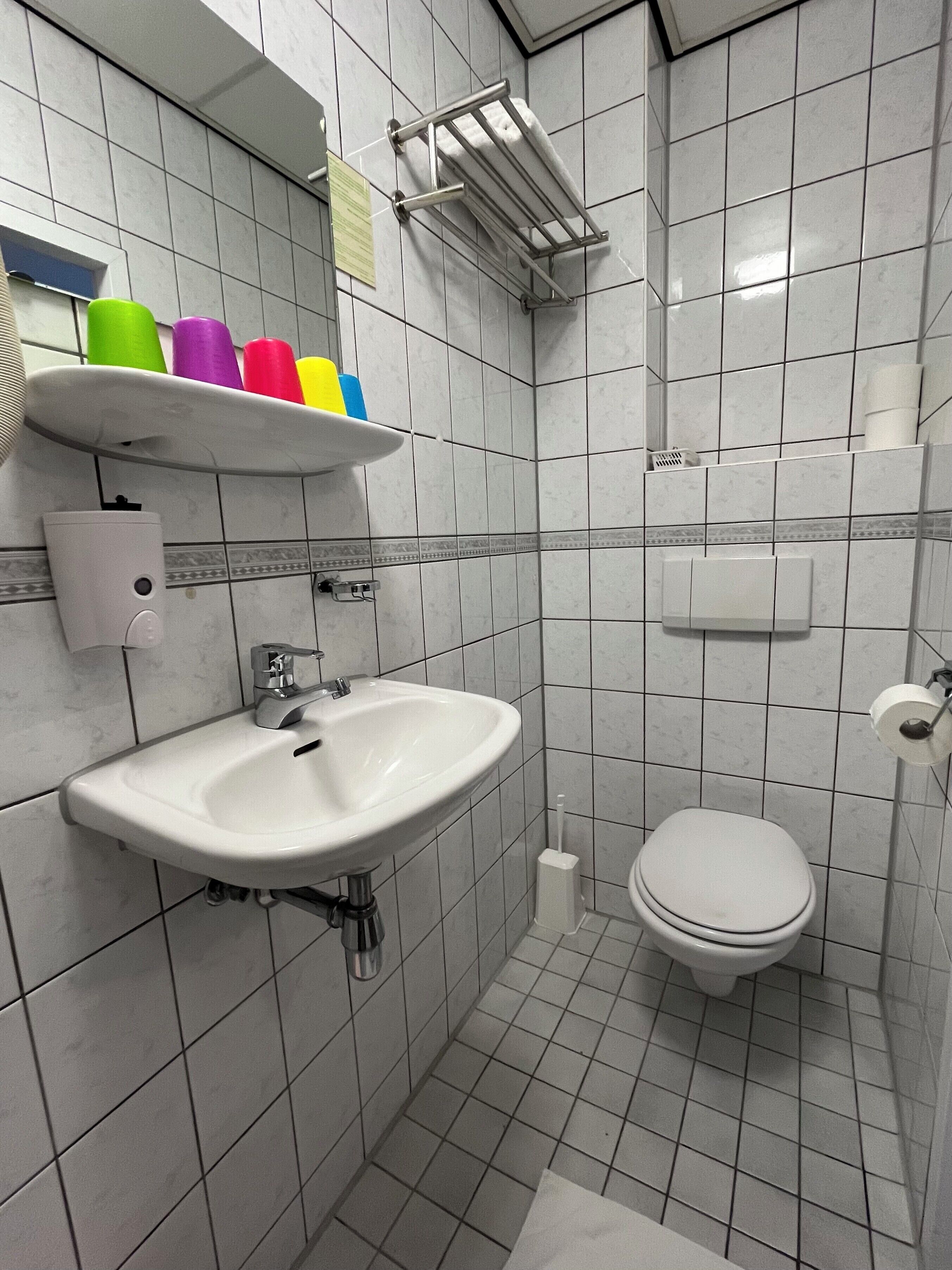 standard quadruple room | bathroom | shower, hair dryer, towels