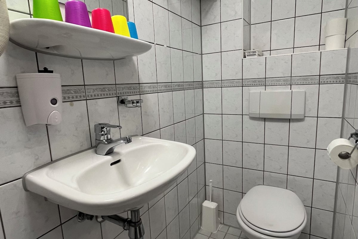 standard quadruple room | bathroom | shower, hair dryer, towels