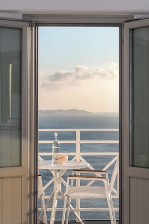Premium bedding, pillowtop beds, in-room safe, individually decorated. Caldera Premium Villas - Adults Only