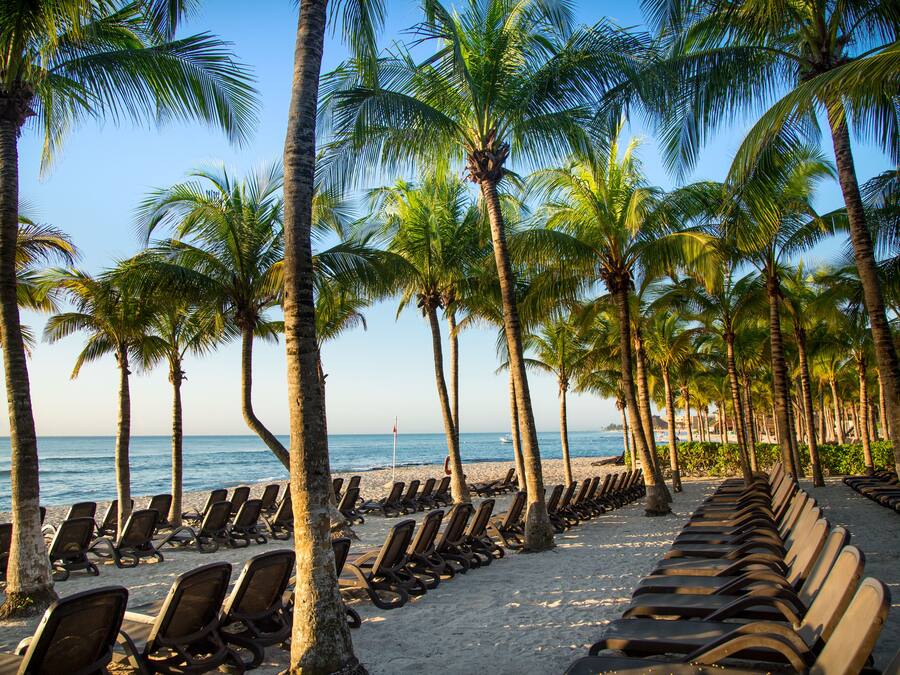 On the beach, white sand, free beach cabanas, sun loungers