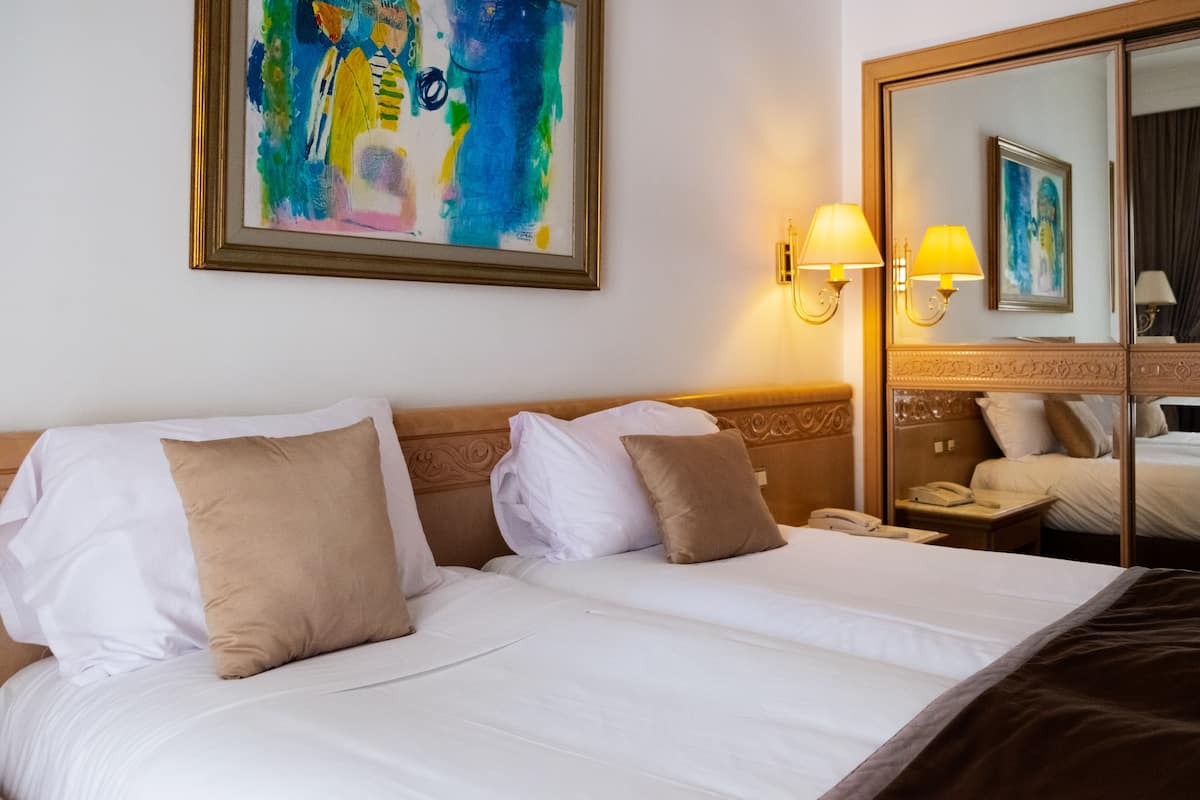 junior suite, pool view | 1 bedroom, minibar, in-room safe, desk