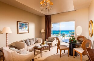 Prestige Suite | Living area | Flat-screen TV