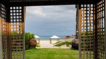 On the beach, sun loungers, beach umbrellas, beach towels