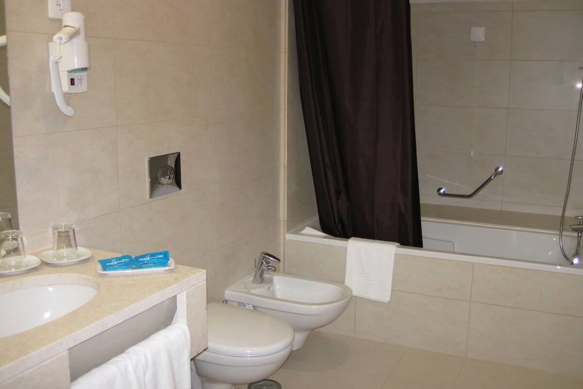 comfort double room, terrace | bathroom | bathtub, rainfall showerhead, hair dryer, bathrobes