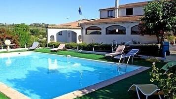 Outdoor pool, open 10:00 AM to 8:00 PM, sun loungers