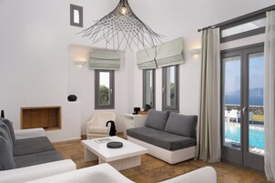 Serenity Villa with Caldera View, Heated Pool & Hot tub in Private Garden | Living room | 32-inch TV with satellite channels, fireplace, DVD player