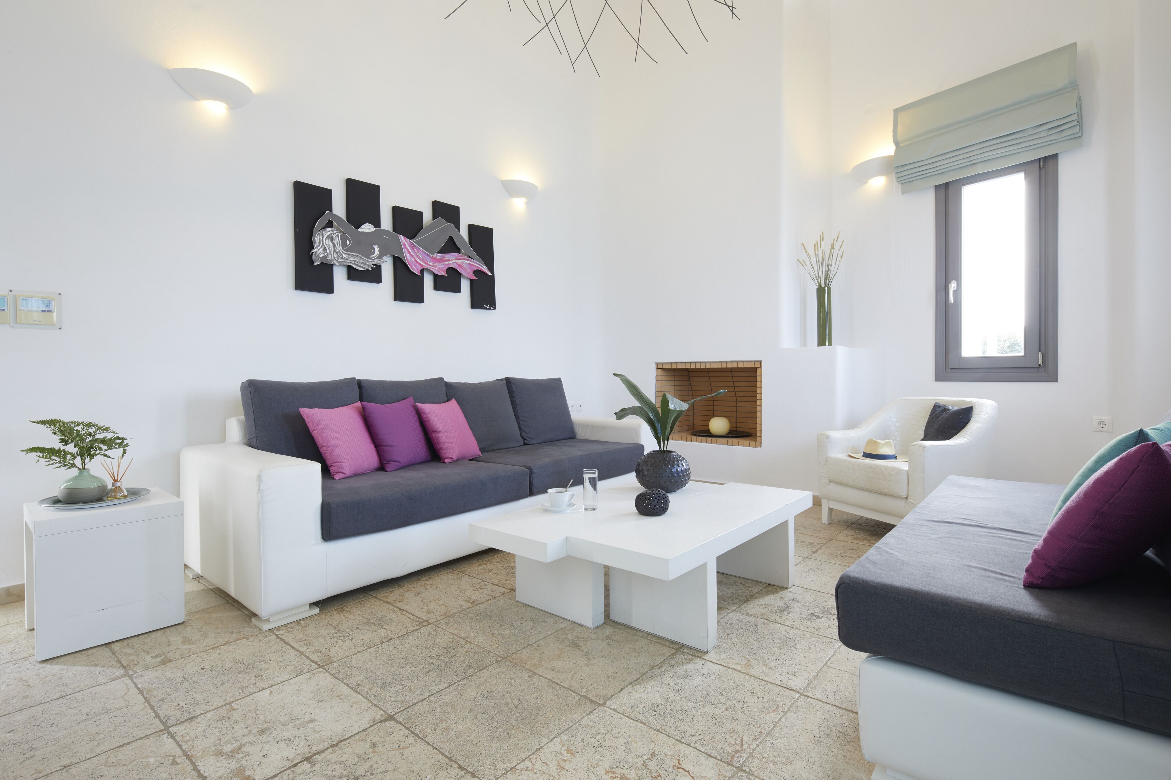 serenity villa with caldera view, heated pool & hot tub in private garden | living area | 32-inch tv with satellite channels, fireplace, dvd player