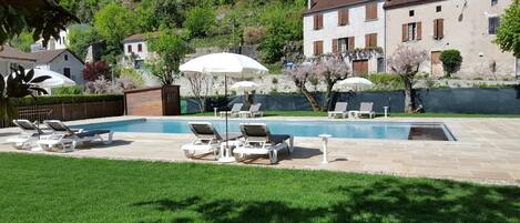 Outdoor pool, open 7:00 AM to 11:00 PM, pool umbrellas, pool loungers