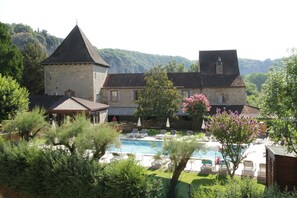Outdoor pool, open 7:00 AM to 11:00 PM, pool umbrellas, pool loungers