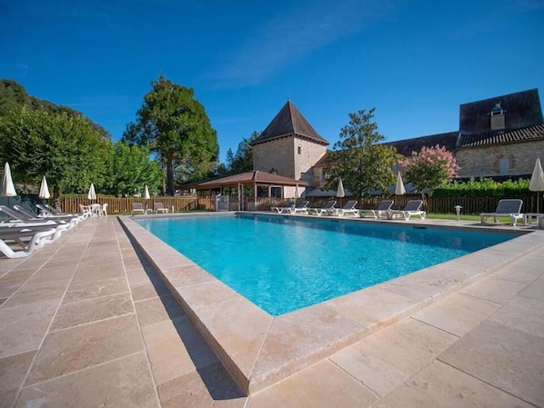 Outdoor pool, open 7:00 AM to 11:00 PM, pool umbrellas, pool loungers