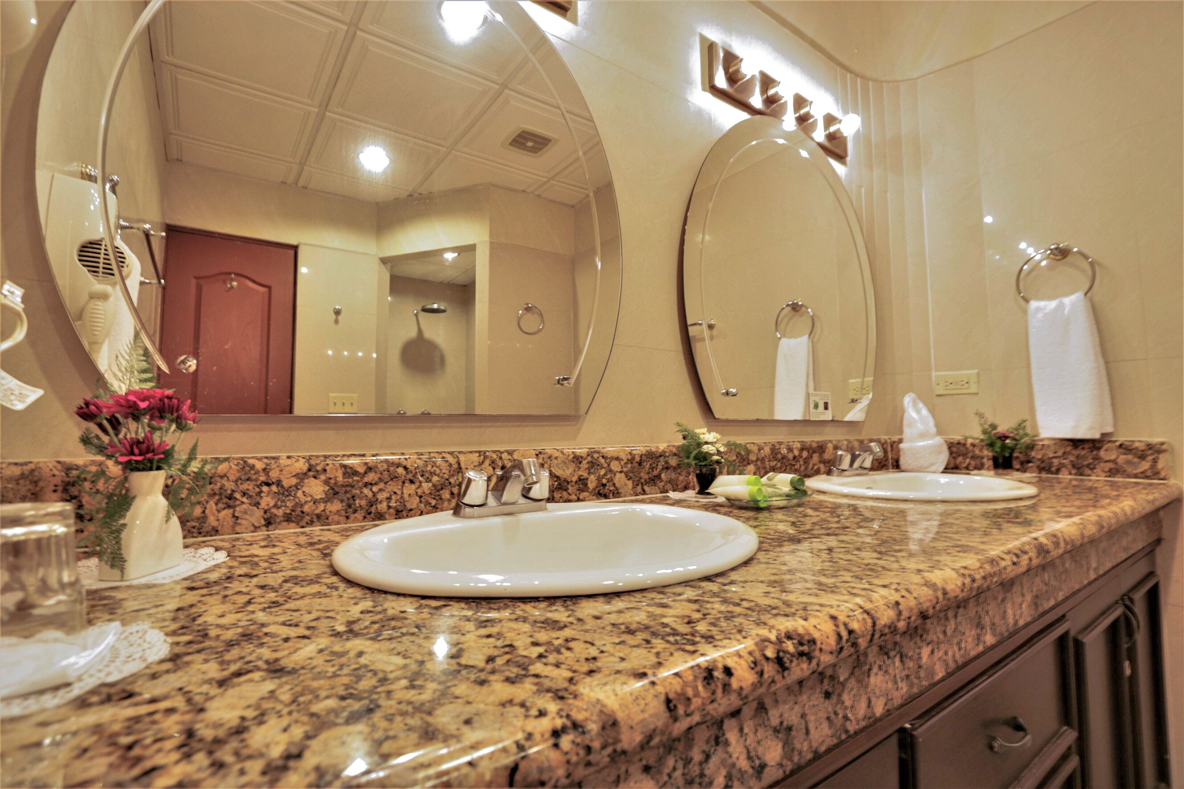 suite | bathroom | shower, rainfall showerhead, hair dryer, towels