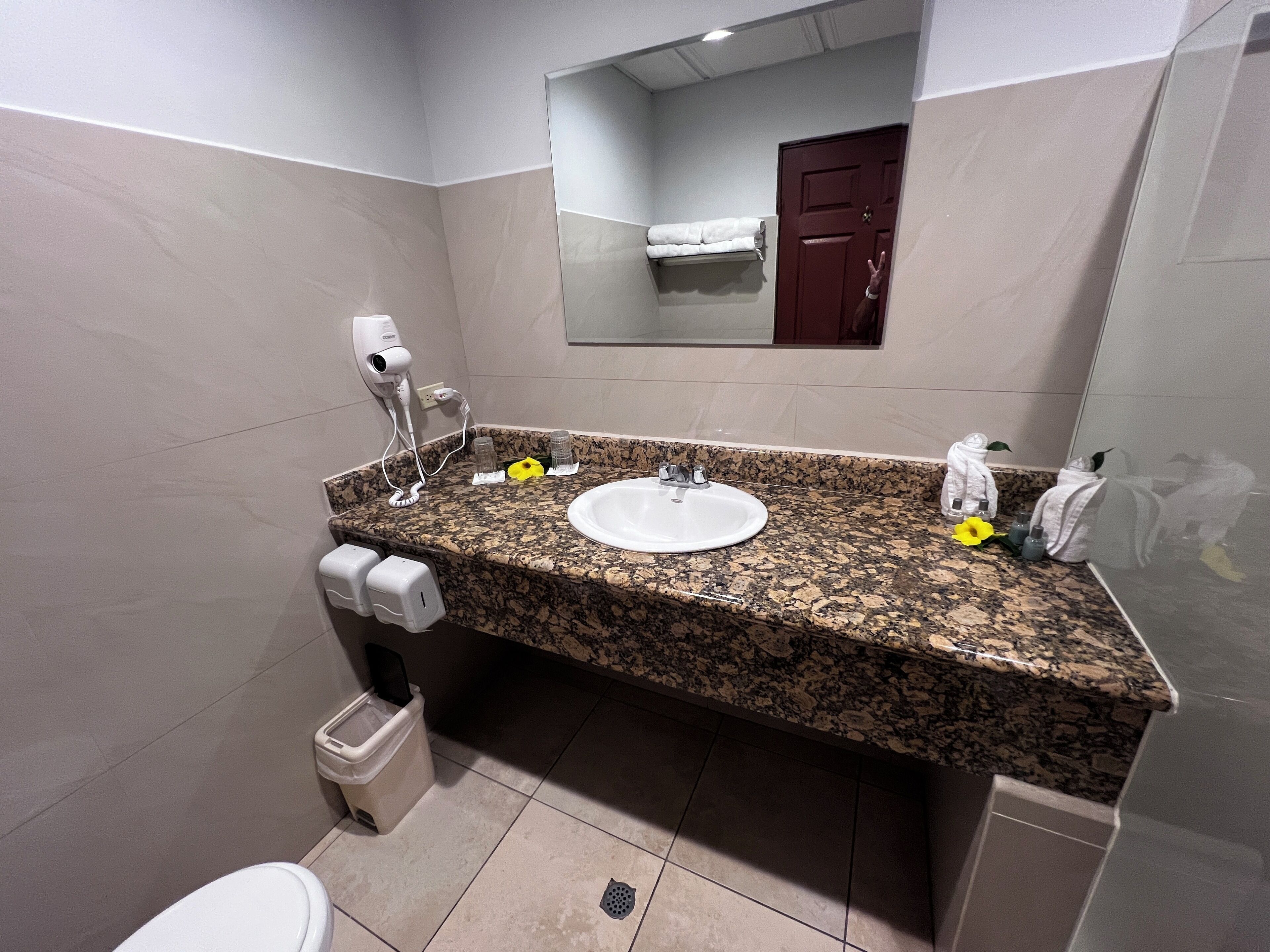 shower, rainfall showerhead, hair dryer, towels