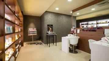Experience a well-organized beauty salon with neatly arranged shelves and a functional reception area.