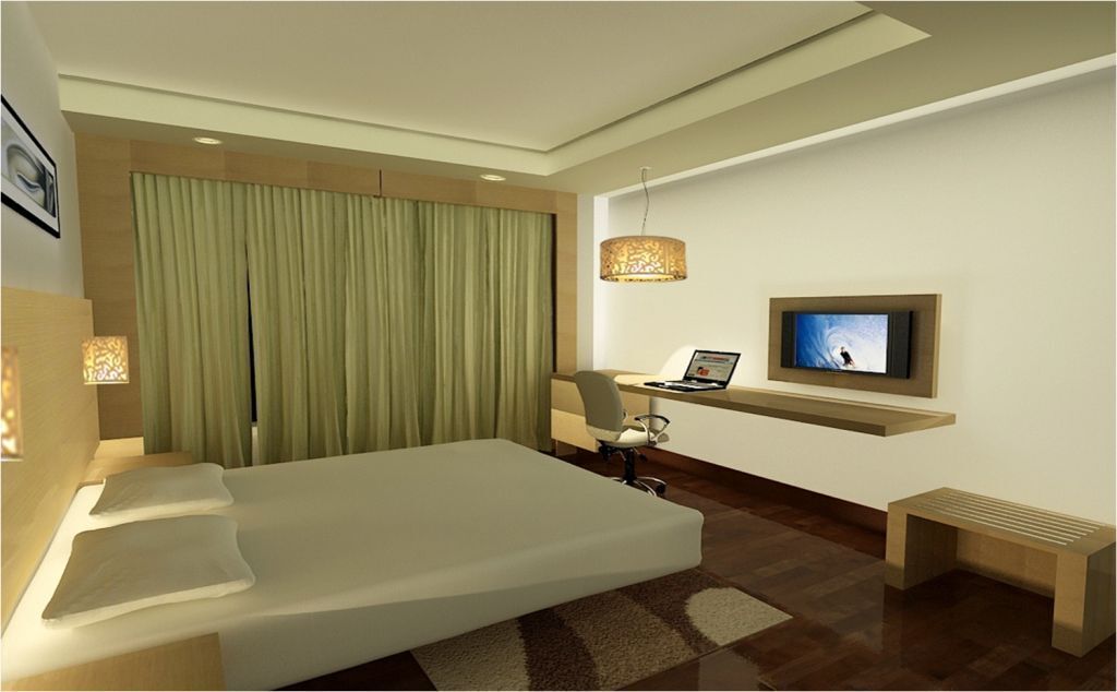 A modern hotel room with a large bed, a desk with a laptop, a television, and a large window with curtains.