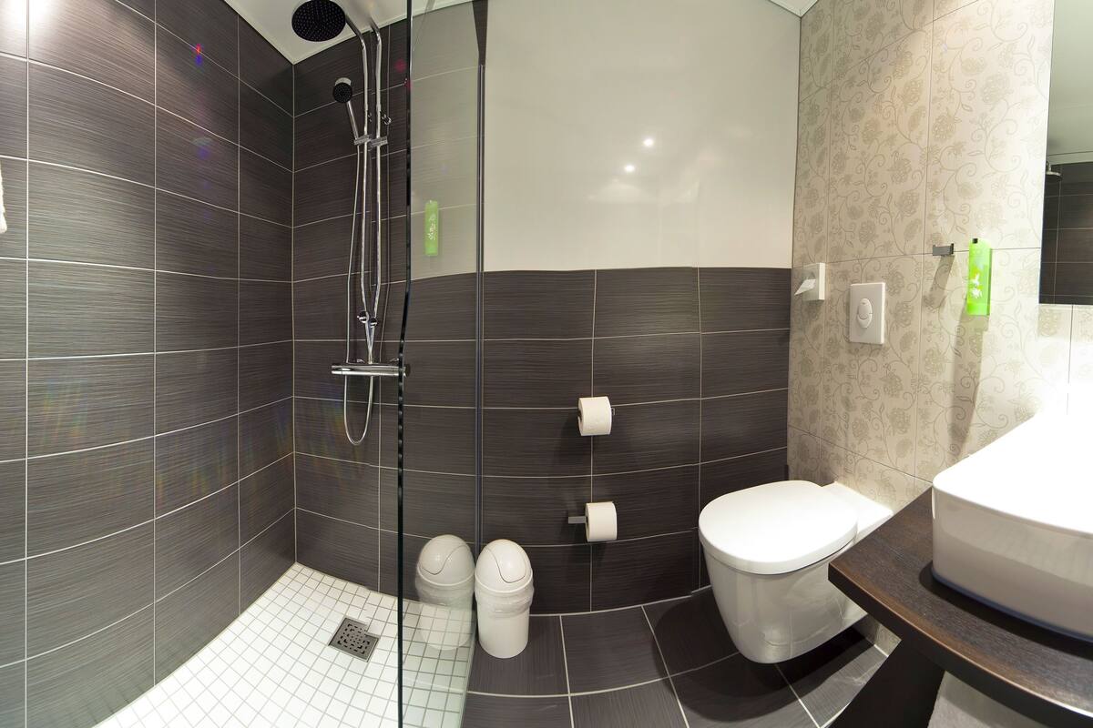 double room | bathroom | shower, rainfall showerhead, hair dryer, towels