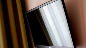 A flat-screen TV mounted on a wall.