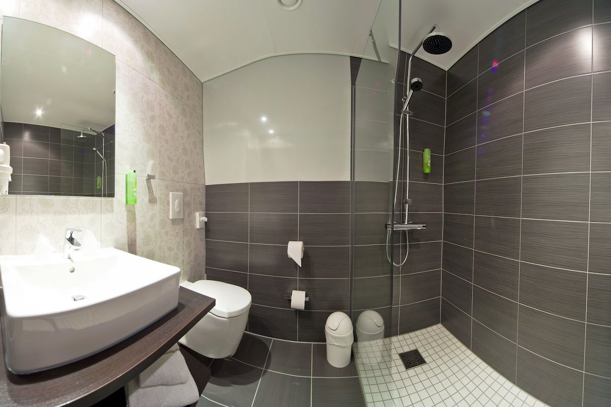 shower, rainfall showerhead, hair dryer, towels