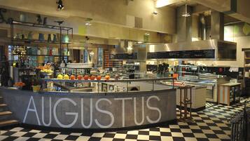 A kitchen area with a checkered floor and a sign that reads "AUGUSTUS".