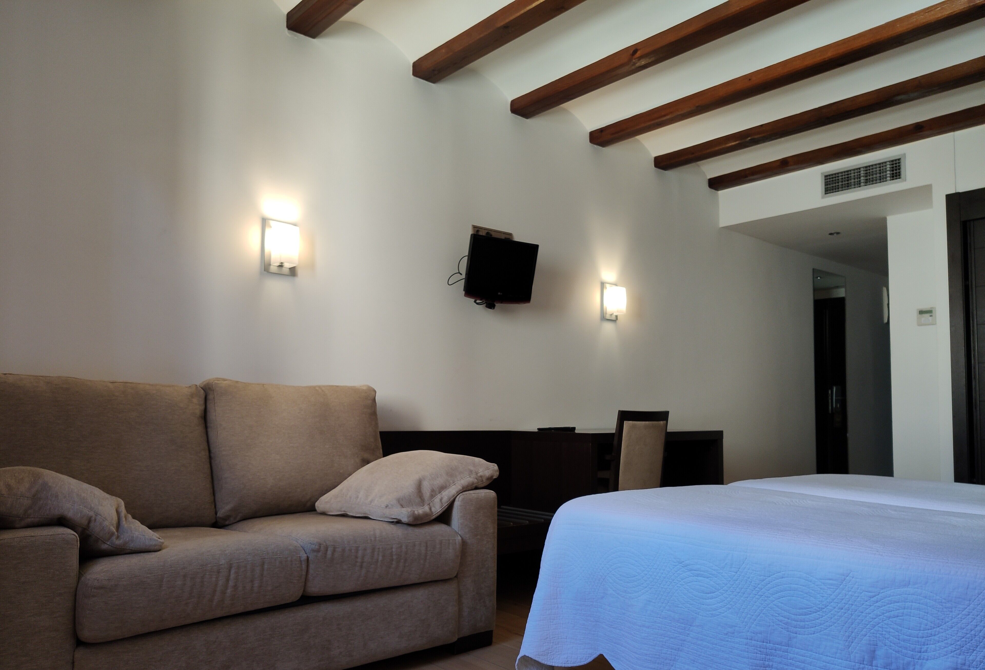 triple room | in-room safe, desk, laptop workspace, blackout curtains