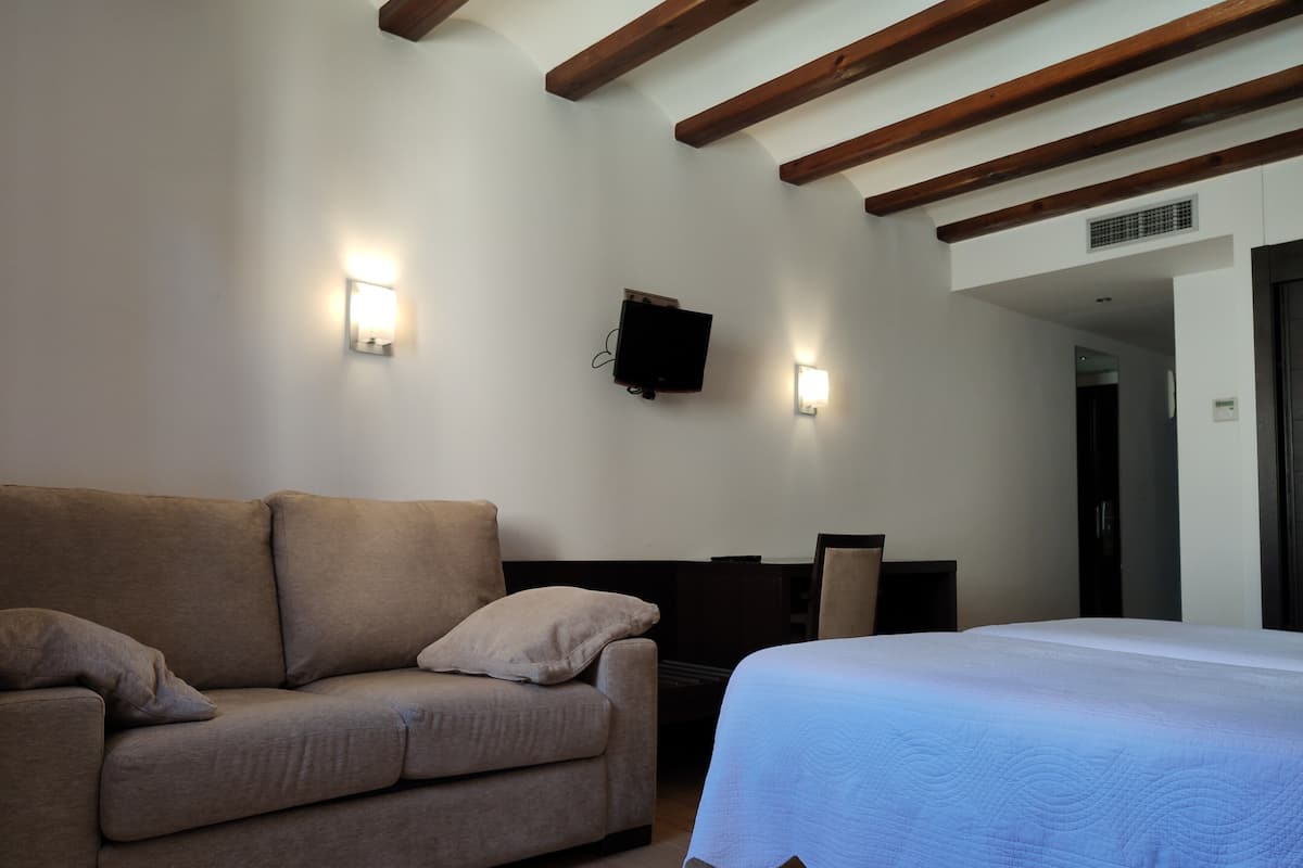 triple room | in-room safe, desk, laptop workspace, blackout curtains