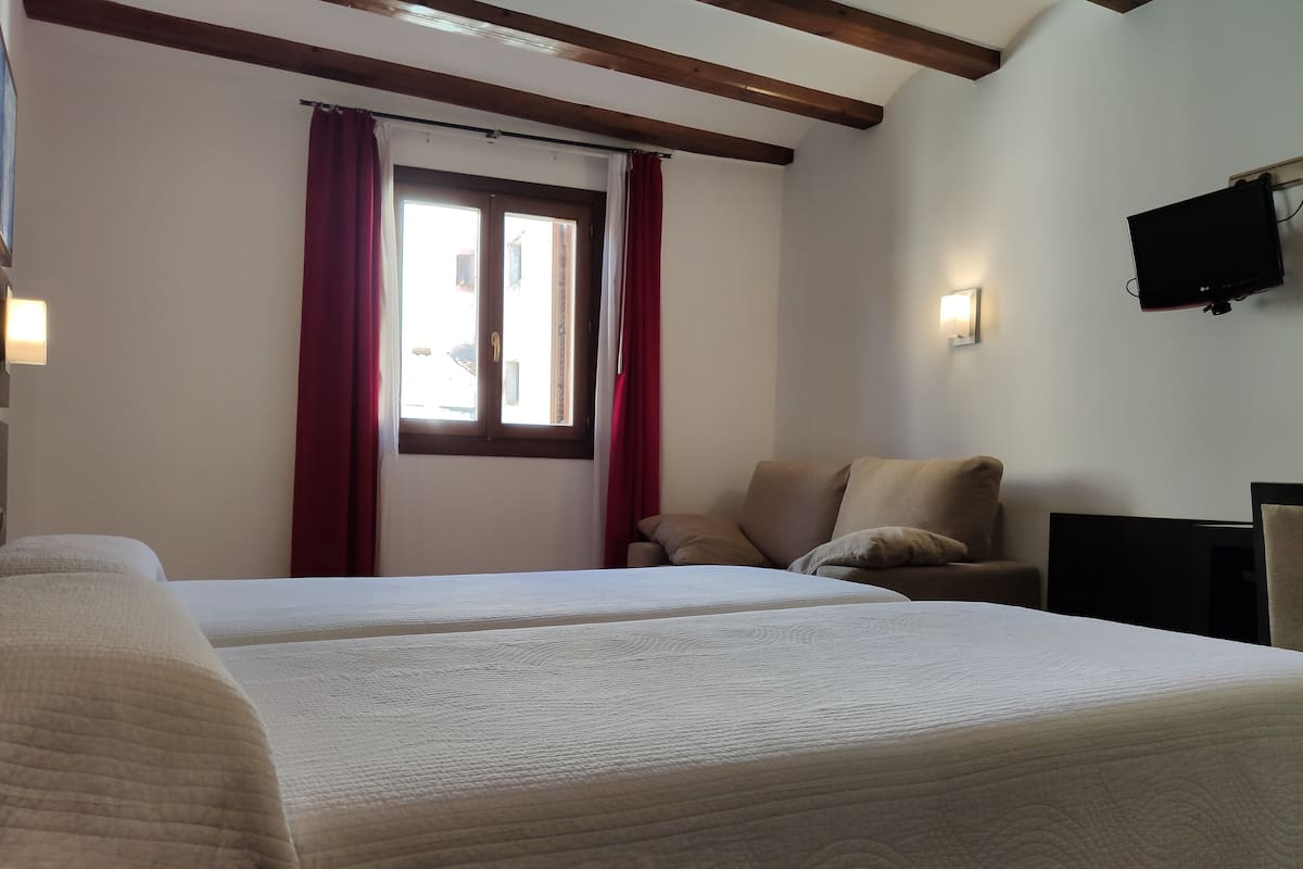 triple room | in-room safe, desk, laptop workspace, blackout curtains