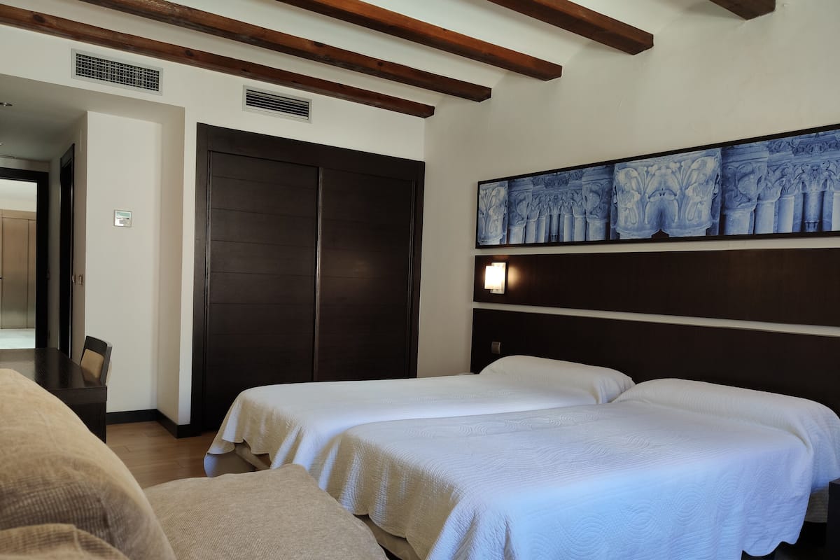 triple room | in-room safe, desk, laptop workspace, blackout curtains