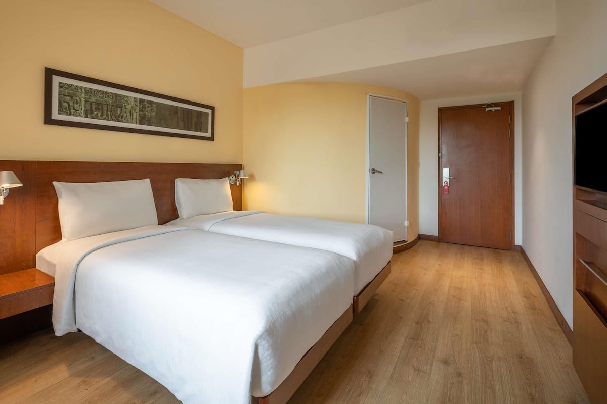 Memory-foam beds, minibar, in-room safe, desk