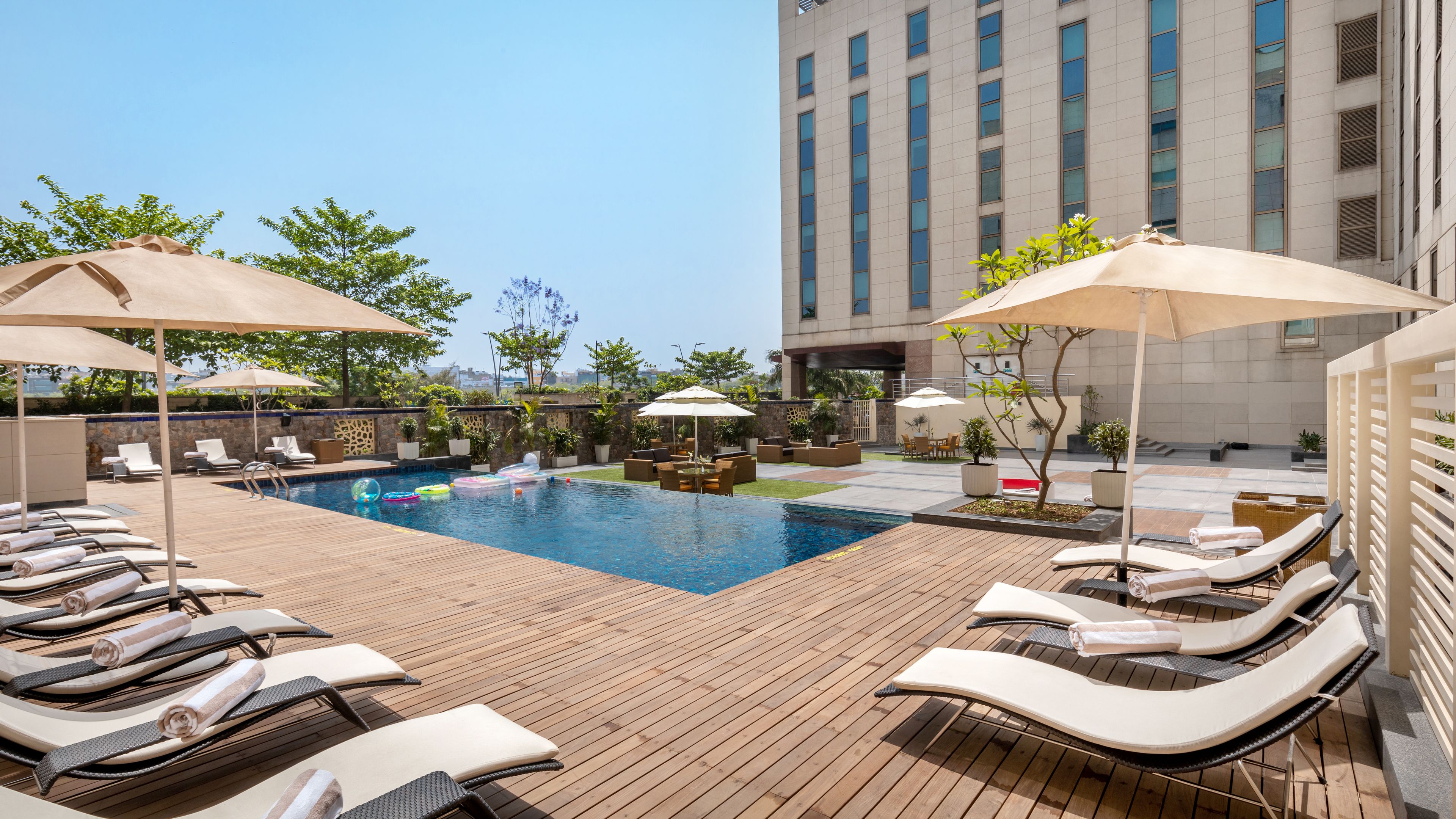 Outdoor pool, open 9:00 AM to 8:00 PM, pool umbrellas, sun loungers