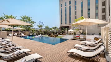 Outdoor pool, open 9:00 AM to 8:00 PM, pool umbrellas, sun loungers