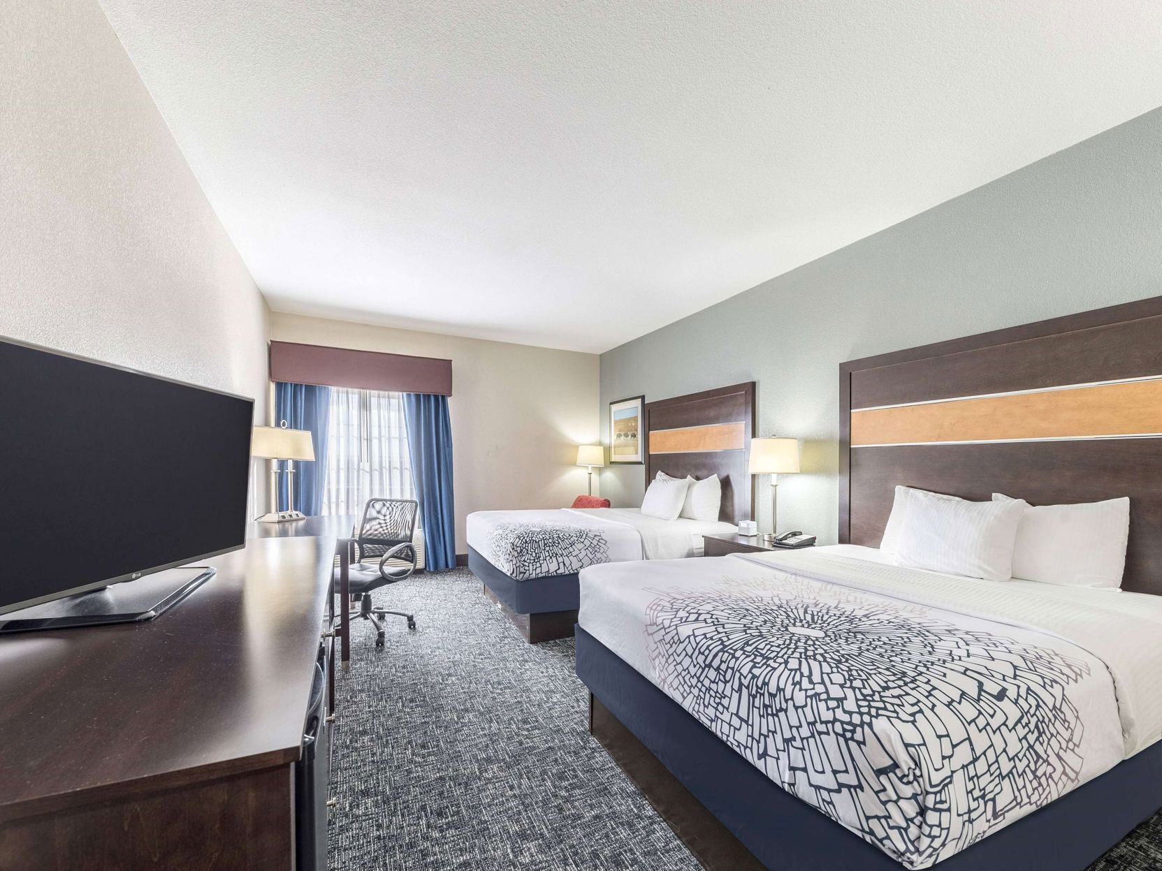 Premium bedding, pillowtop beds, desk, blackout drapes