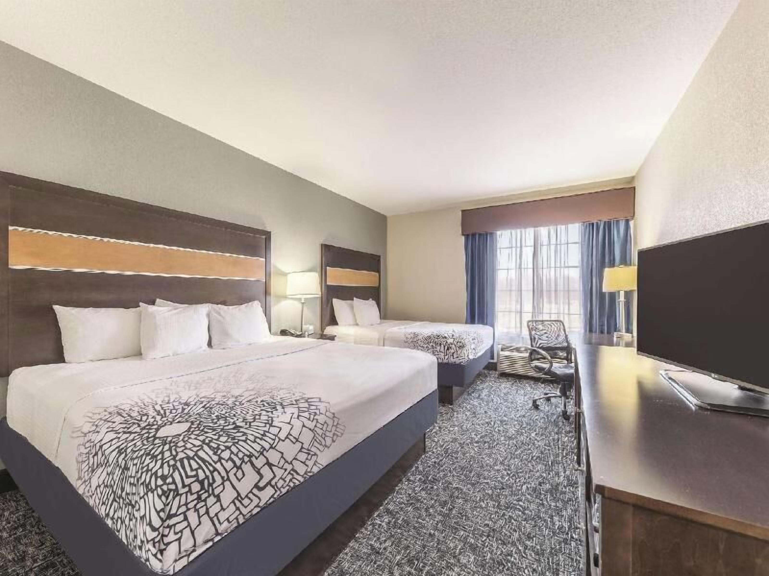 Premium bedding, pillowtop beds, desk, blackout drapes